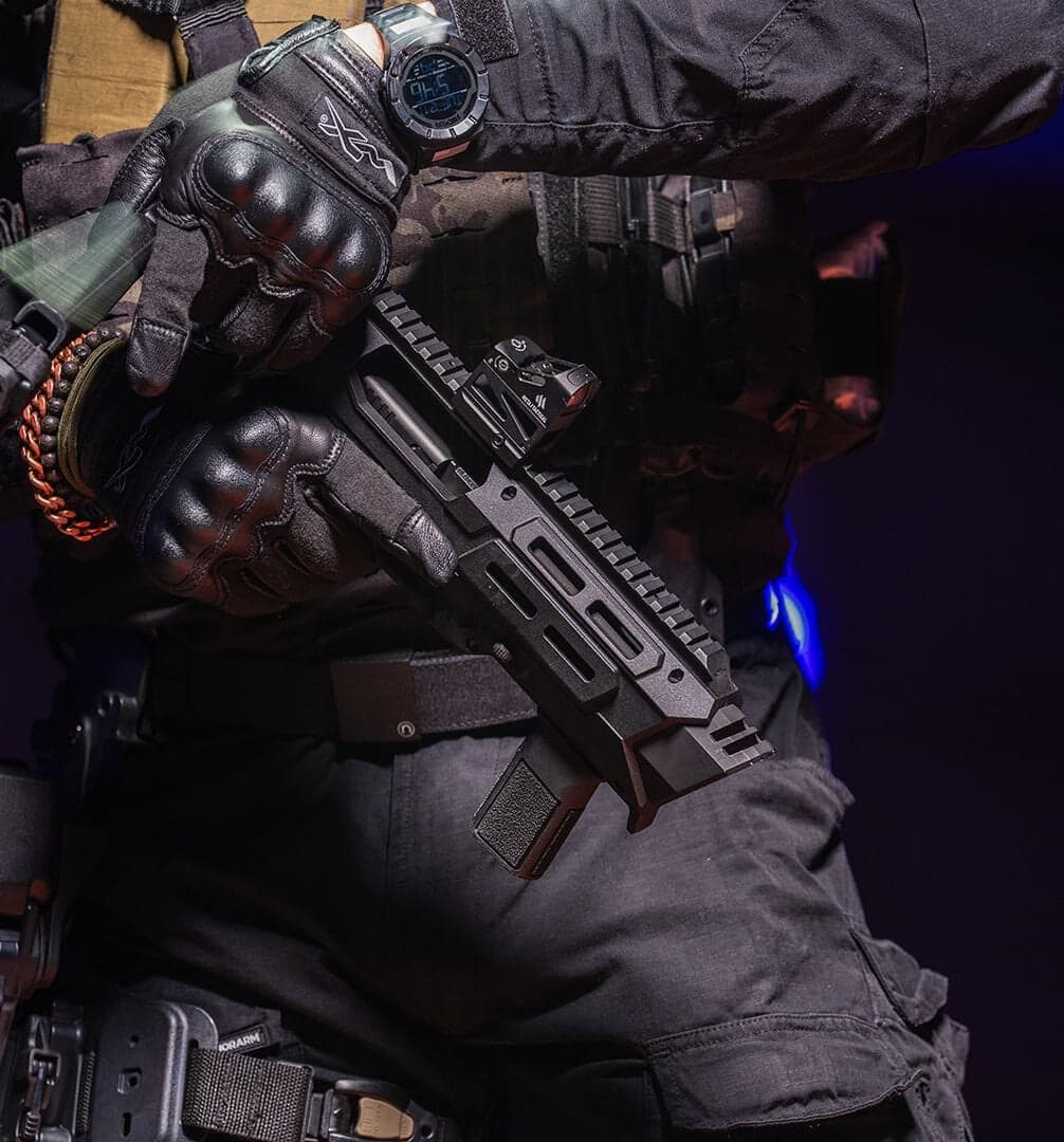 Gloved hands on a slung Meta Tactical MX-1