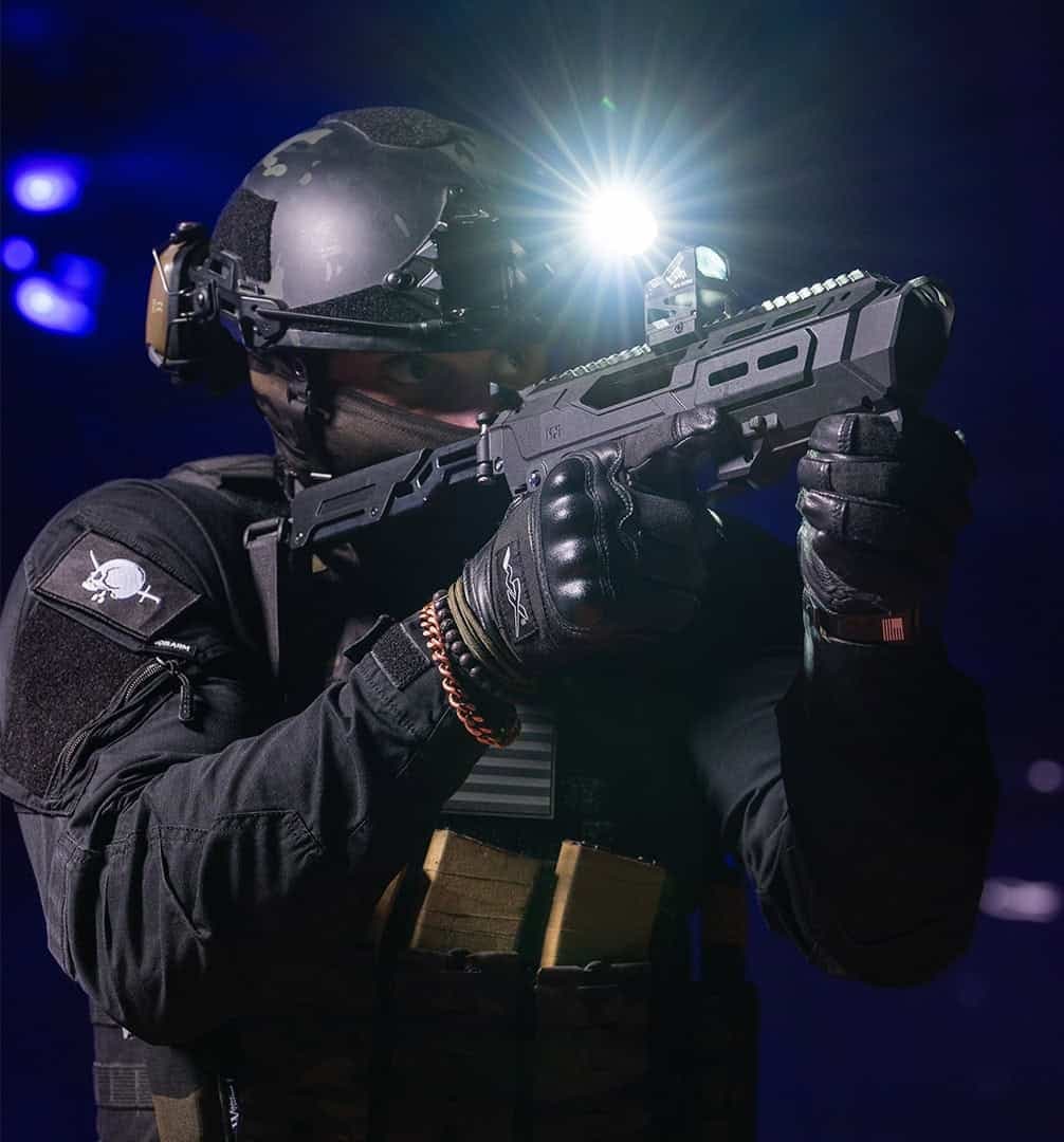 Shooter aiming the Meta Tactical MX-1 with a weapon light